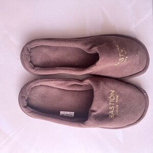 brown Bastion Luxury Hotel disposable slippers, likely made of coral velvet.